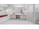 Bright main bathroom with double sink vanity, walk-in shower and tub at 10446 Baylor Dr, Spring Hill, FL 34608