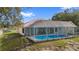 Side view of a private backyard pool with screened-in enclosure, perfect for swimming and outdoor enjoyment at 10446 Baylor Dr, Spring Hill, FL 34608