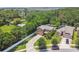 Aerial view of a home showcasing a large lot, mature trees, and a well-maintained landscape at 10512 Scenic Hollow Dr, Riverview, FL 33578
