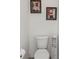 Bright bathroom featuring a toilet and storage cabinet at 10512 Scenic Hollow Dr, Riverview, FL 33578
