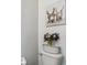 Stylish bathroom decor with wainscoting and playful donkey art at 10512 Scenic Hollow Dr, Riverview, FL 33578
