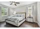 Spacious bedroom featuring a ceiling fan and hardwood floors at 10512 Scenic Hollow Dr, Riverview, FL 33578