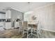 Bright dining room with a decorative chandelier, stylish furnishings, and wood-look tile floors at 10512 Scenic Hollow Dr, Riverview, FL 33578