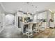 Bright open kitchen featuring a large island, stainless steel appliances and tile flooring at 10512 Scenic Hollow Dr, Riverview, FL 33578