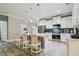 Bright open kitchen featuring a large island, stainless steel appliances and tile flooring at 10512 Scenic Hollow Dr, Riverview, FL 33578