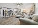 Open concept living space with kitchen, dining and living room areas, wood-look tile flooring at 10512 Scenic Hollow Dr, Riverview, FL 33578