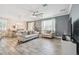 Open concept living room with tile floors, modern furnishings, and dining area at 10512 Scenic Hollow Dr, Riverview, FL 33578