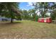 Large backyard with a shed and plenty of green space at 12412 Lakeview Dr, Dade City, FL 33525