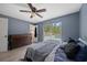 This bedroom includes a ceiling fan and access to the outdoors at 12412 Lakeview Dr, Dade City, FL 33525