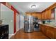 Well-equipped kitchen features stainless steel appliances, granite countertops, and wooden cabinets at 12412 Lakeview Dr, Dade City, FL 33525