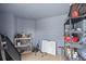 Unfinished storage room with shelves, suitable for storing tools and other household items at 12412 Lakeview Dr, Dade City, FL 33525