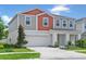 Two-story home with a two-car garage, a concrete driveway, and stylish exterior paint combination at 12782 Canter Call Rd, Lithia, FL 33547