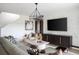Bright living room featuring stylish furniture, a large TV, and modern decor at 12782 Canter Call Rd, Lithia, FL 33547
