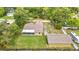 Aerial view of home with backyard, pool, screened in lanai and detached garage at 1332 Osceola Hollow Rd, Odessa, FL 33556