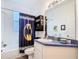 Bathroom with Batman themed shower curtain, vanity, and sink at 1332 Osceola Hollow Rd, Odessa, FL 33556