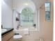Bright bathroom features a soaking tub and a large window with a view at 1332 Osceola Hollow Rd, Odessa, FL 33556
