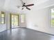 This bedroom is spacious and bright with neutral walls and a door to the lanai at 1332 Osceola Hollow Rd, Odessa, FL 33556