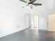 Light-filled bedroom features a ceiling fan and en-suite bath at 1332 Osceola Hollow Rd, Odessa, FL 33556