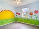 Playful bedroom featuring a cheerful mural, ceiling fan, and natural light at 1332 Osceola Hollow Rd, Odessa, FL 33556