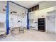 Garage interior featuring a vehicle lift, ample workspace, and organizational elements at 1332 Osceola Hollow Rd, Odessa, FL 33556