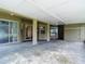 Covered patio featuring concrete flooring and sliding glass doors for seamless indoor-outdoor living at 1332 Osceola Hollow Rd, Odessa, FL 33556