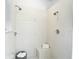 Tiled walk-in shower with bench, dual showerheads, and included towel at 1332 Osceola Hollow Rd, Odessa, FL 33556