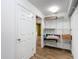 Spacious walk-in closet with shelving and ample storage space; laminate flooring visible at 1332 Osceola Hollow Rd, Odessa, FL 33556