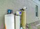 Water filtration system installed near the home exterior ensures clean water throughout the property at 1332 Osceola Hollow Rd, Odessa, FL 33556