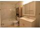 Bathroom with white tile walls, vanity with sink and storage, and a bathtub with shower at 13758 Orange Sunset Dr # 202, Tampa, FL 33618