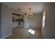 Dining area featuring tile floors and a modern chandelier at 13758 Orange Sunset Dr # 202, Tampa, FL 33618