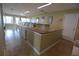 Well-lit community laundry room with multiple washing machines, folding counter, and clean tile floors at 13758 Orange Sunset Dr # 202, Tampa, FL 33618