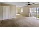 Open-concept living area with a sliding glass door to the balcony at 13758 Orange Sunset Dr # 202, Tampa, FL 33618