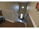 View from top of staircase looking down toward front entry of the building at 13758 Orange Sunset Dr # 202, Tampa, FL 33618
