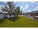 Beautiful lakefront home with a well-maintained green lawn at 13758 Orange Sunset Dr # 202, Tampa, FL 33618