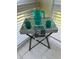 Balcony featuring natural light and small tray table for outdoor relaxing at 1408 Millstream Ln # 206, Dunedin, FL 34698