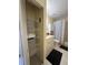Storage closet in the bathroom with shelving at 1408 Millstream Ln # 206, Dunedin, FL 34698
