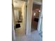 View into bathroom and bedroom featuring neutral colors and tile floors at 1408 Millstream Ln # 206, Dunedin, FL 34698
