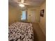 Spacious bedroom with neutral carpet and closet for ample storage at 1408 Millstream Ln # 206, Dunedin, FL 34698