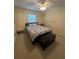 Comfortable bedroom with ceiling fan and a window for natural light at 1408 Millstream Ln # 206, Dunedin, FL 34698