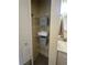 Linen closet with shelving in the bathroom at 1408 Millstream Ln # 206, Dunedin, FL 34698