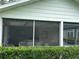 View of the community clubhouse featuring a screened porch for gatherings at 1408 Millstream Ln # 206, Dunedin, FL 34698