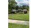 Beautiful Lake Tiffany community sign surrounded by manicured landscaping and lush green lawns in a well-maintained setting at 1408 Millstream Ln # 206, Dunedin, FL 34698