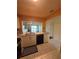 Kitchen with stainless sink and granite countertops and view to living room at 1408 Millstream Ln # 206, Dunedin, FL 34698