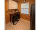 Cozy eat-in kitchen with breakfast bar, white cabinets, and a window for natural light at 1408 Millstream Ln # 206, Dunedin, FL 34698