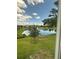 Scenic lake view with picnic bench and fountain at 1408 Millstream Ln # 206, Dunedin, FL 34698
