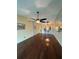 Hardwood floors unite the living room and kitchen for seamless entertaining in this modern home at 1408 Millstream Ln # 206, Dunedin, FL 34698