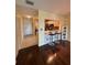Inviting living room flows into the kitchen, featuring sleek floors and a breakfast bar at 1408 Millstream Ln # 206, Dunedin, FL 34698
