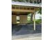 Assigned covered parking space with storage lockers, providing convenient parking for residents of this beautiful community at 1408 Millstream Ln # 206, Dunedin, FL 34698