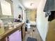 Bathroom with double sinks, toilet, shower/tub combo at 14210 Downing St, Dover, FL 33527
