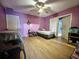 A spacious bedroom featuring an overhead fan and two beds at 14210 Downing St, Dover, FL 33527